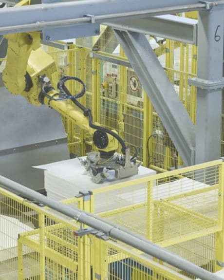 An industrial robotic arm operating within Lenzing's advanced manufacturing facility, reflecting the precision-driven production technologies behind TENCEL™ Lyocell and Modal fibers.